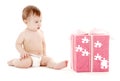 Baby boy in diaper with big puzzle gift box Royalty Free Stock Photo