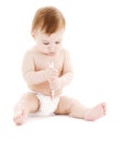 Baby boy in diaper with toothbrush Royalty Free Stock Photo