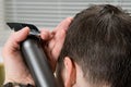 Baby boy, do a haircut, a shorter electric shaver, in a hairdressers Royalty Free Stock Photo