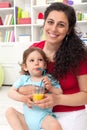 Baby boy drinking fruit juice Royalty Free Stock Photo