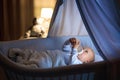 Baby boy drinking milk in bed Royalty Free Stock Photo