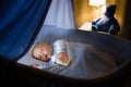 Baby boy drinking milk in bed Royalty Free Stock Photo