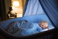 Baby boy drinking milk in bed Royalty Free Stock Photo