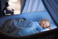 Baby boy drinking milk in bed Royalty Free Stock Photo