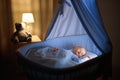 Baby boy drinking milk in bed Royalty Free Stock Photo