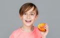 Baby boy eating apple and smiling. Boy smiles and has healthy white teeth. Little boy eating apple. Boy apples showing Royalty Free Stock Photo