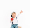 Baby boy eating apple and smiling in the studio isolated on white background Royalty Free Stock Photo