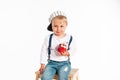 Baby boy eating apple and smiling in the studio isolated on white background Royalty Free Stock Photo