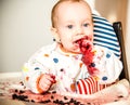 Baby boy eating blueberries, happpy face Royalty Free Stock Photo