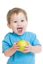 Baby boy eating green apple, isolated on white