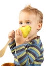 Baby boy eating pear Royalty Free Stock Photo