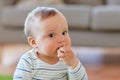 Baby boy eating rice cracker at home Royalty Free Stock Photo
