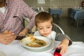 Baby boy eating soup Royalty Free Stock Photo