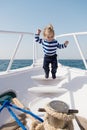 Baby boy enjoy vacation sea cruise ship. Child sailor. Boy sailor travelling sea. Boy sailor striped shirt sea yacht