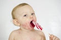 Baby boy enjoying a giant lollipop