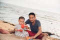 Baby boy and father dad playing fun on sand beach nature Royalty Free Stock Photo