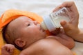 Baby boy and feeding bottle