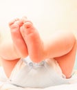 Baby boy with feet in the air after diaper change Royalty Free Stock Photo