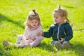 Baby boy and girl pick flowers on green grass. Brother and sister play with toy horse on sunny day. Kids Family. Future Royalty Free Stock Photo