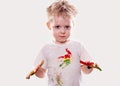 The baby boy with gouache soiled hands and shirt isolated Royalty Free Stock Photo