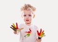 The baby boy with gouache soiled hands and shirt isolated Royalty Free Stock Photo