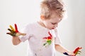 The baby boy with gouache soiled hands and shirt isolated Royalty Free Stock Photo