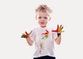 The baby boy with gouache soiled hands and shirt isolated Royalty Free Stock Photo