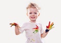 The baby boy with gouache soiled hands and shirt isolated