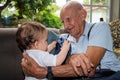 Baby boy with great grandfather Royalty Free Stock Photo