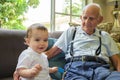 Baby boy with great grandfather Royalty Free Stock Photo