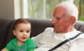 Baby boy with great grandfather Royalty Free Stock Photo