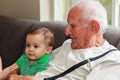 Baby boy with great grandfather Royalty Free Stock Photo