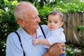 Baby boy with great grandfather Royalty Free Stock Photo