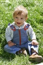 Baby boy in green grass Royalty Free Stock Photo