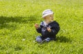 Baby boy on green grass Royalty Free Stock Photo