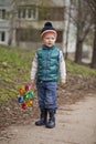Baby boy in green jaket and blue jeans Royalty Free Stock Photo
