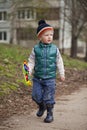 Baby boy in green jaket and blue jeans Royalty Free Stock Photo