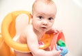 Baby boy having bath, looking Royalty Free Stock Photo