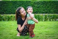 Baby boy with his mum in the park. Royalty Free Stock Photo