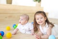 Baby boy and his sister playing with balls. Colorful toys for kids. Kids in play room Royalty Free Stock Photo