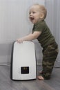 Baby boy and humidifier Royalty Free Stock Photo