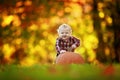 Baby boy with large pumpkin