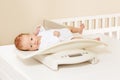 Baby boy lay on a scale for measuring body weight