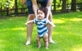 Baby boy learning to walk outside Royalty Free Stock Photo