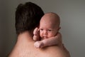 Baby boy looking over the his father shoulders Royalty Free Stock Photo