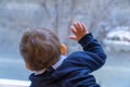 Baby boy looking through a window Royalty Free Stock Photo