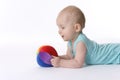 Baby boy looks at ball Royalty Free Stock Photo