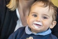 Baby boy with milk mustache making funny faces Royalty Free Stock Photo