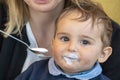 Baby boy with milk mustache making funny faces Royalty Free Stock Photo