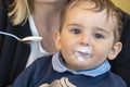 Baby boy with milk mustache making funny faces Royalty Free Stock Photo